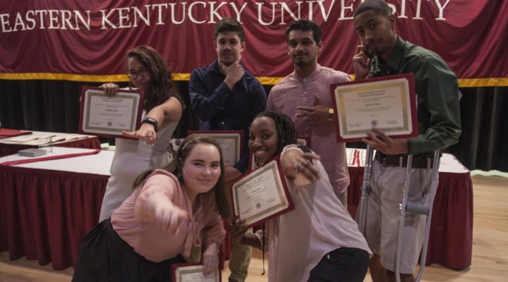 Award recipients show off their certificates